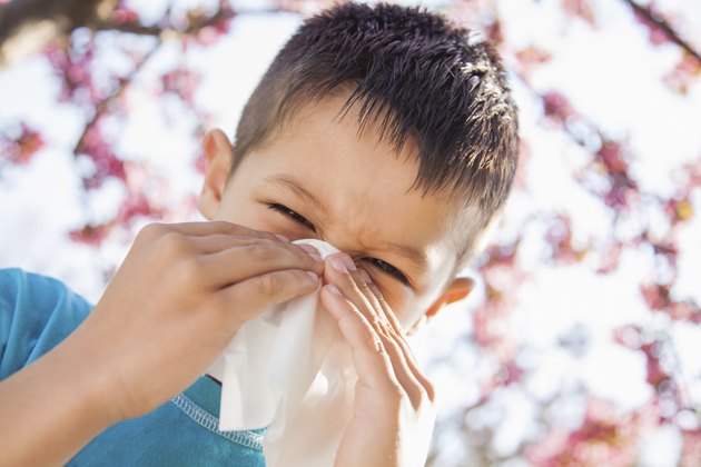 Little boy sneezing
