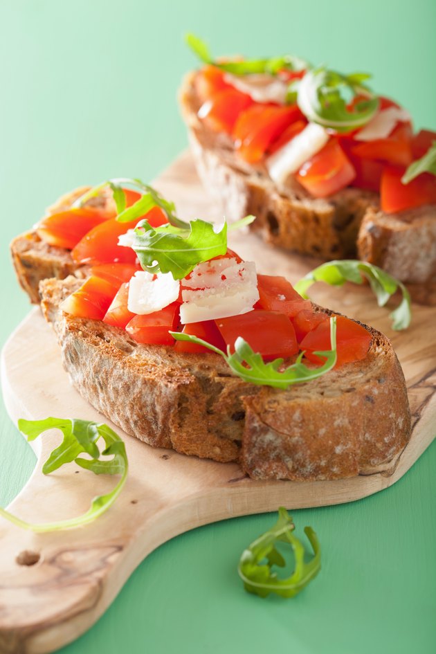 italian bruschetta with tomatoes parmesan rucola