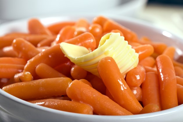 baby carrots with butter in bowl