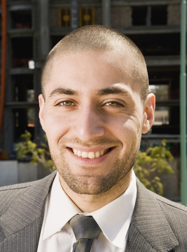 Close up of Hispanic businessman smiling