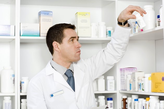 Pharmacist with pill bottle