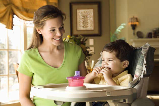 Mother feeding her son