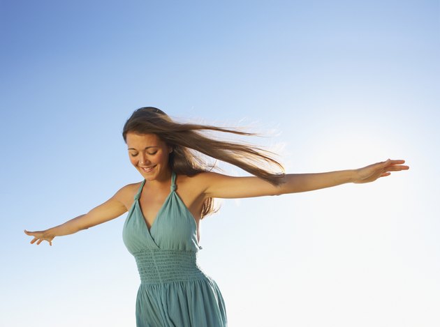Woman standing with arms out