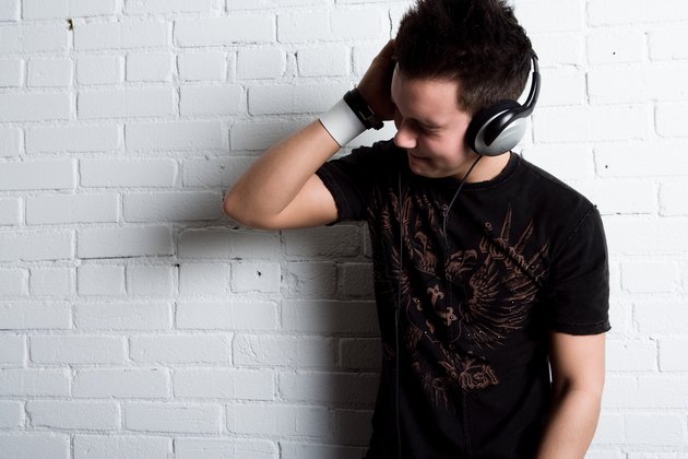 Boy listening to music on headphones