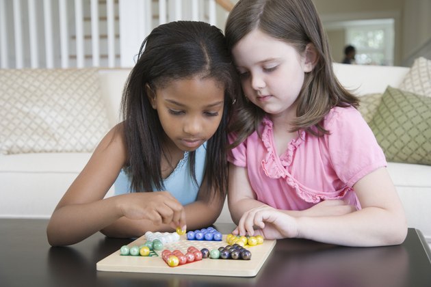 Close-up of a two girls playing a board game