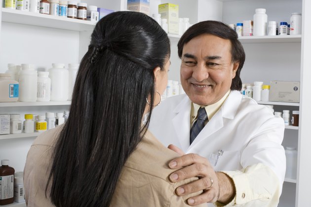 Pharmacist talking to a customer