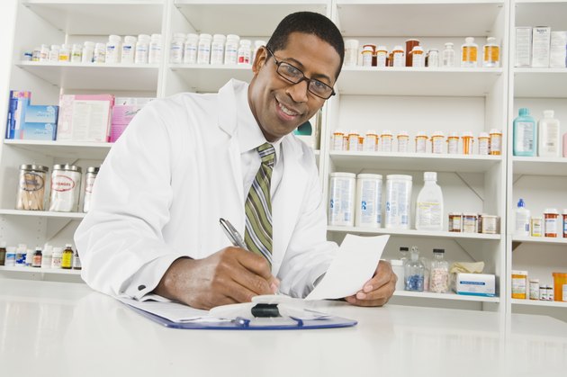 Male pharmactist working in pharmacy