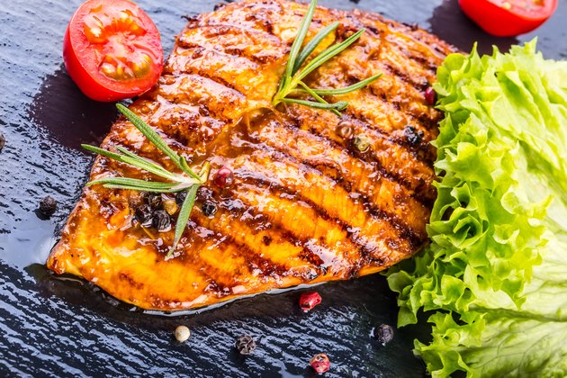 Steak chicken breast on granit board.