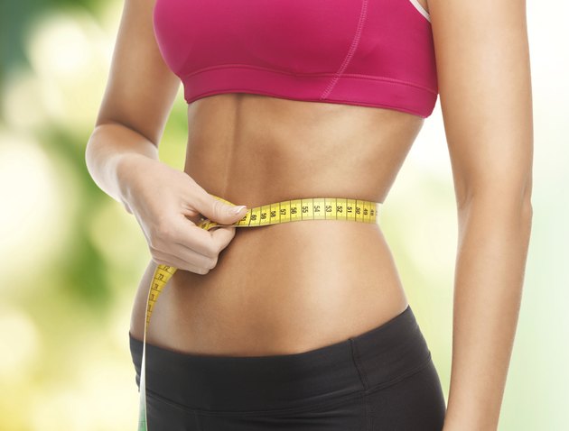 trained belly with measuring tape