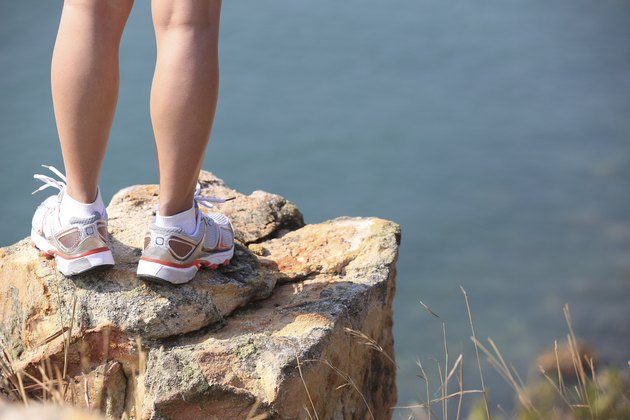 hiking feet seaside rock