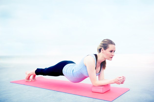 Pregnant woman doing fitness exercises