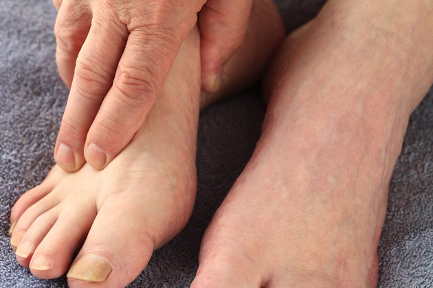 Man with his hand on a foot