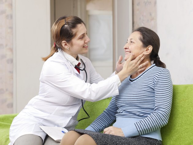 doctor examining mature woman