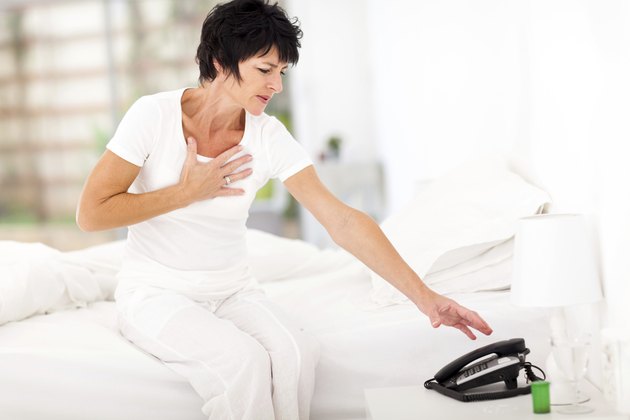 middle aged woman having heart attack