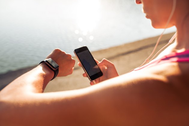Sportswoman using smart devices
