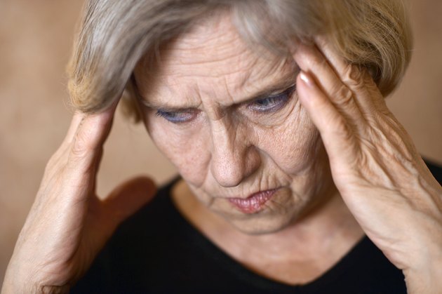 older woman with a headache