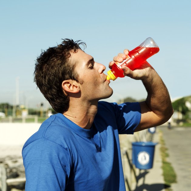 portrait of a young man drinking fluid