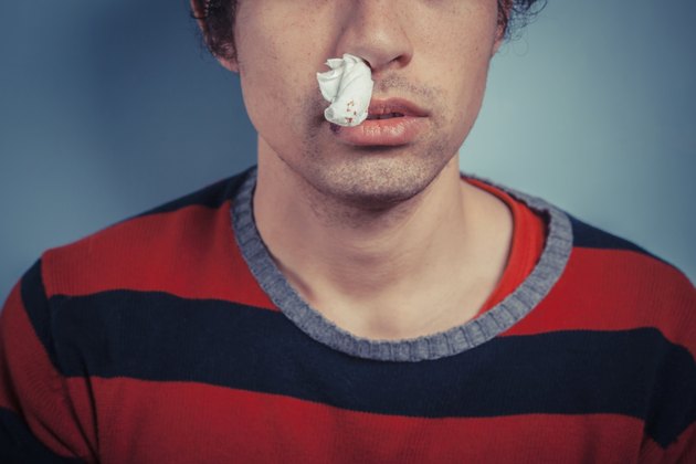 Man with nose bleed and cold sores