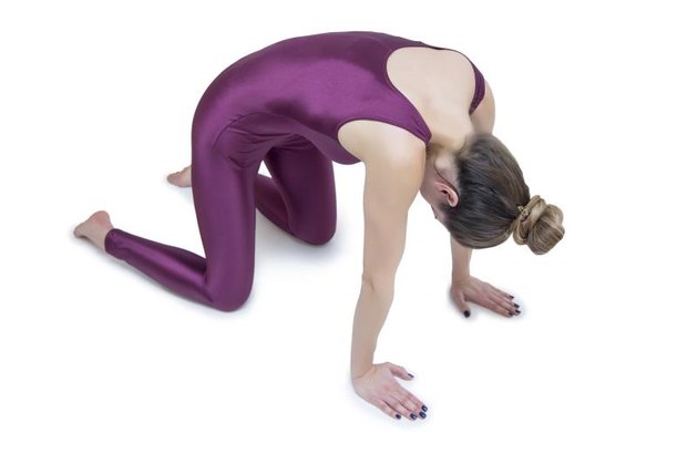 Young woman practicing yoga in the studio