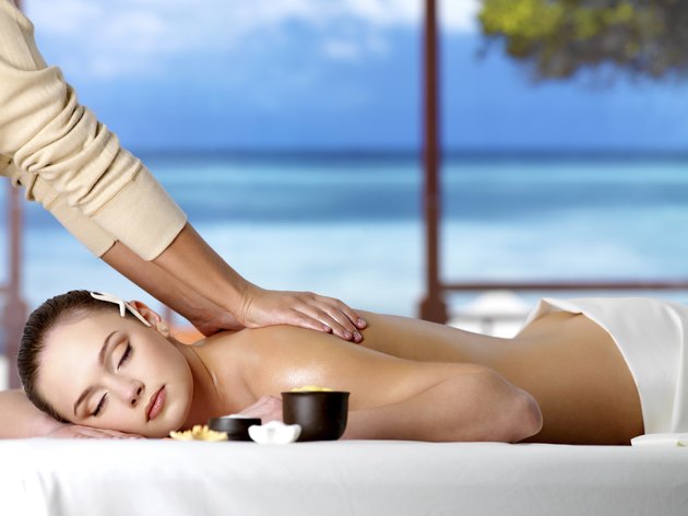 Relaxing woman having spa massage