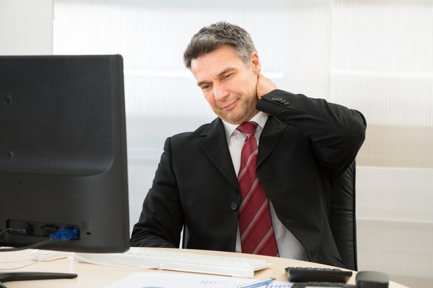 Businessman Suffering From Neck Pain