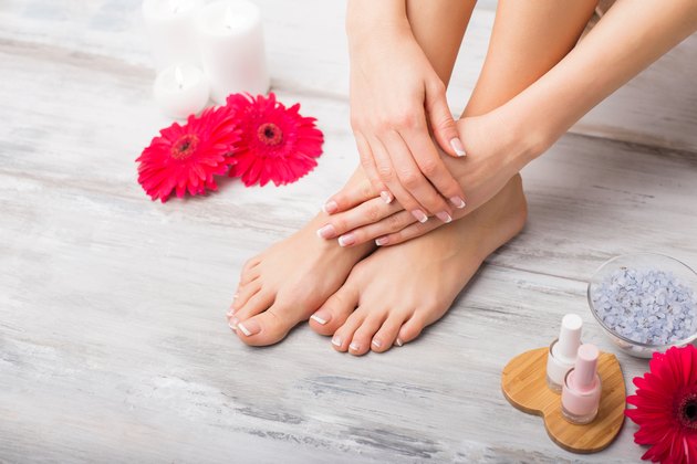 Woman at spa doing manicure and pedicure