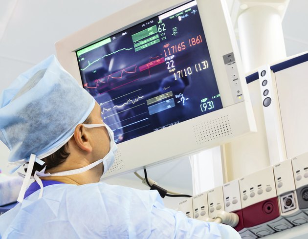 Male anaesthesiologist with monitor