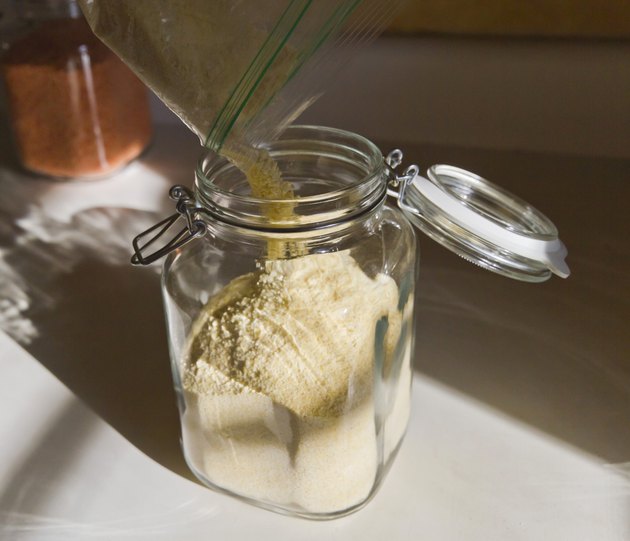 Pouring Cornstarch Into a Glass Jar