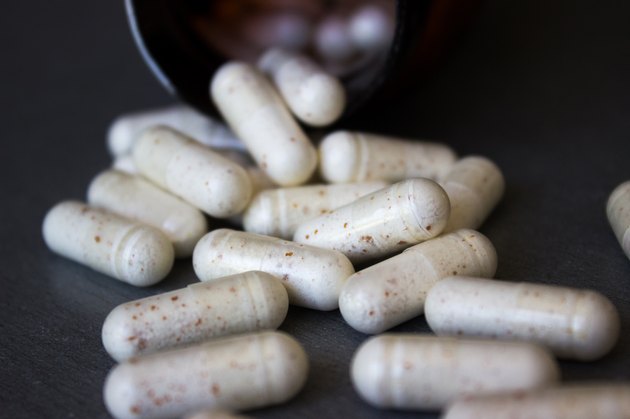 medicine bottle with scattered pills
