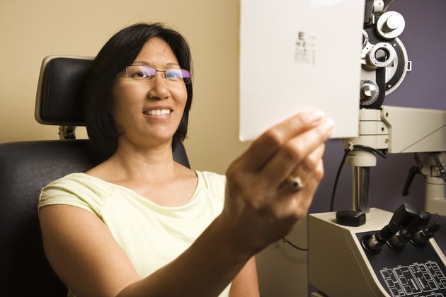 Woman getting eye exam