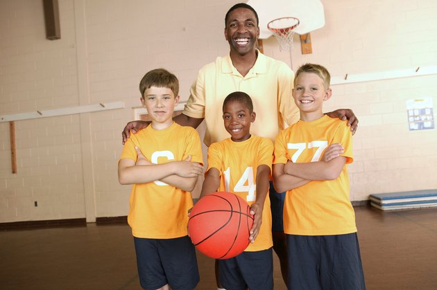Basketball coach with players