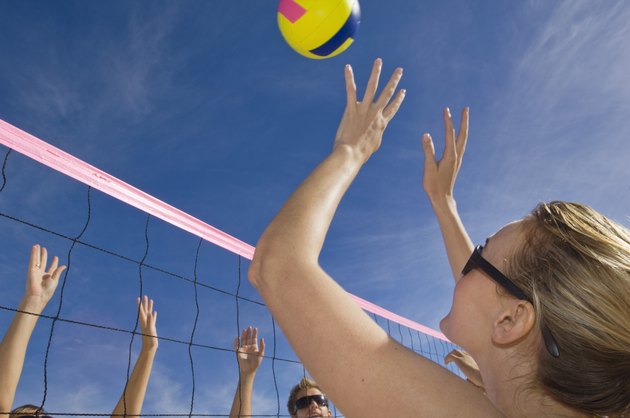 Friends playing volleyball