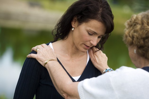 Senior woman consoling her daughter