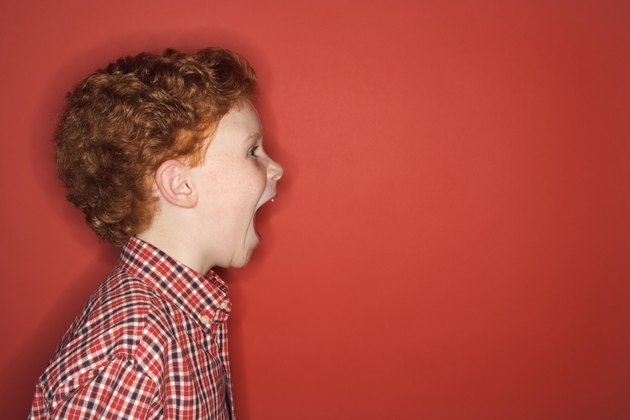 Studio shot of boy screaming