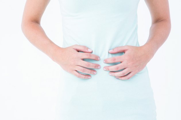 Woman suffering from stomach pain