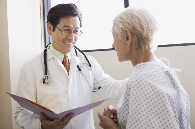 Doctor with patient and open file