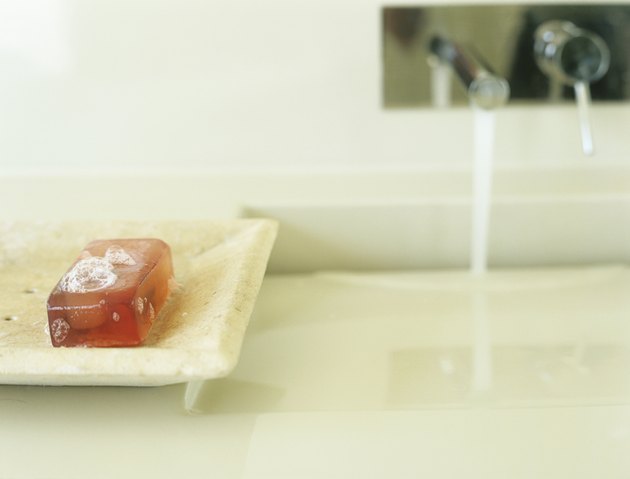 Bar of soap in soap dish by sink