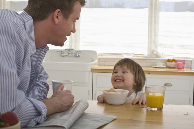 father and child at breakfast