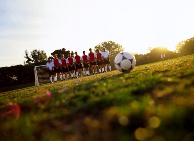 Soccer Team Standing in front of Goal