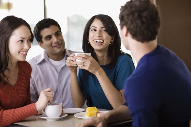 Friends talking in cafe