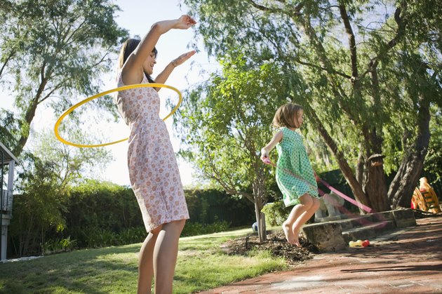 Mother and daughter playing outdoors