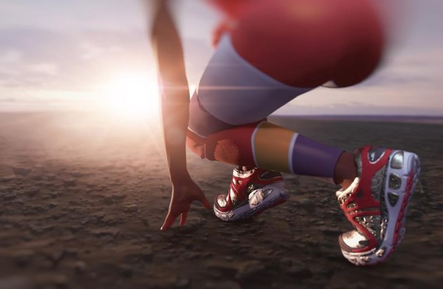 athletic woman moving and action to the running in the desert to the sunset