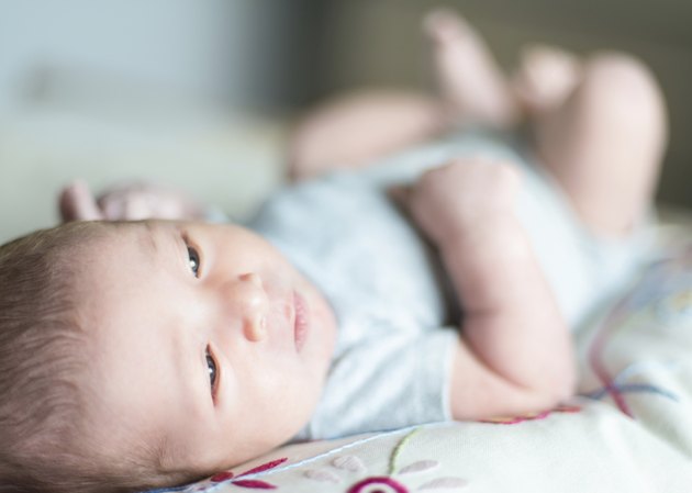 Cute newborn baby serie on grey