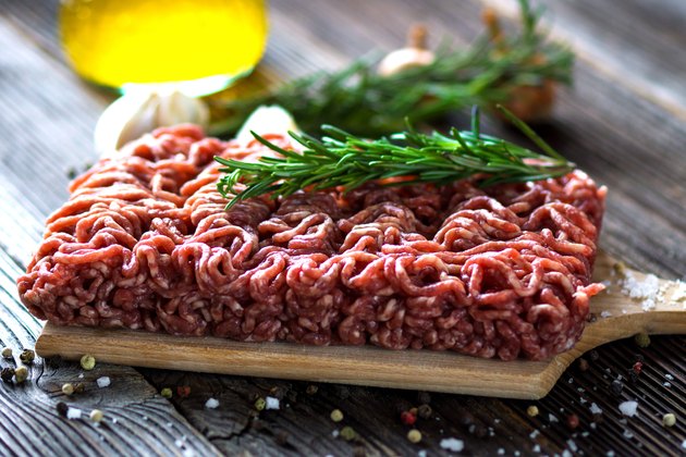 Minced Meat on wooden background