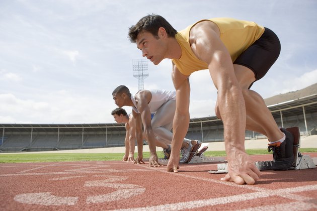 Athletes crouching at starting line
