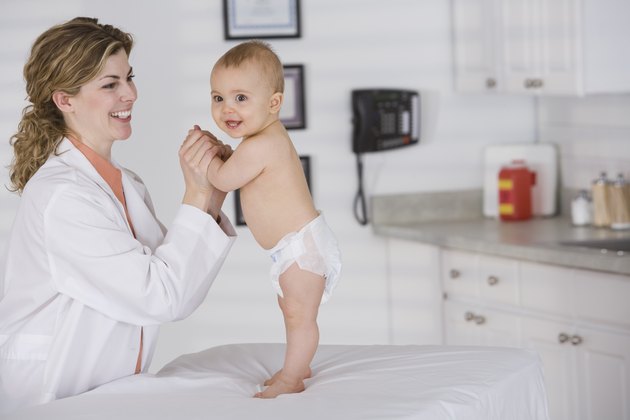 Doctor examining baby