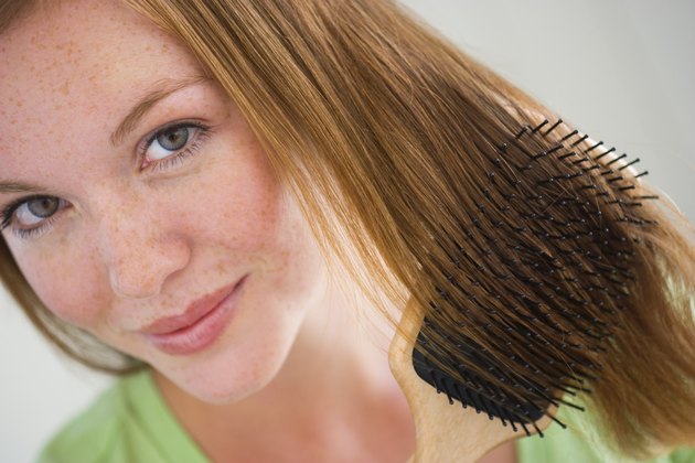 Woman combing her hair