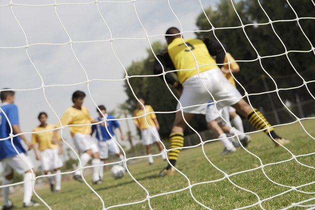 Soccer Players Competing for the Ball