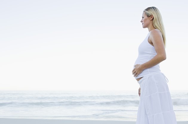 Pregnant woman on beach
