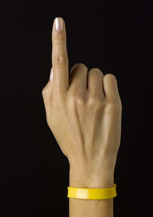 Yellow band on wrist